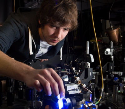 PhD student Joe Randall operating an ion trap quantum computing experiment