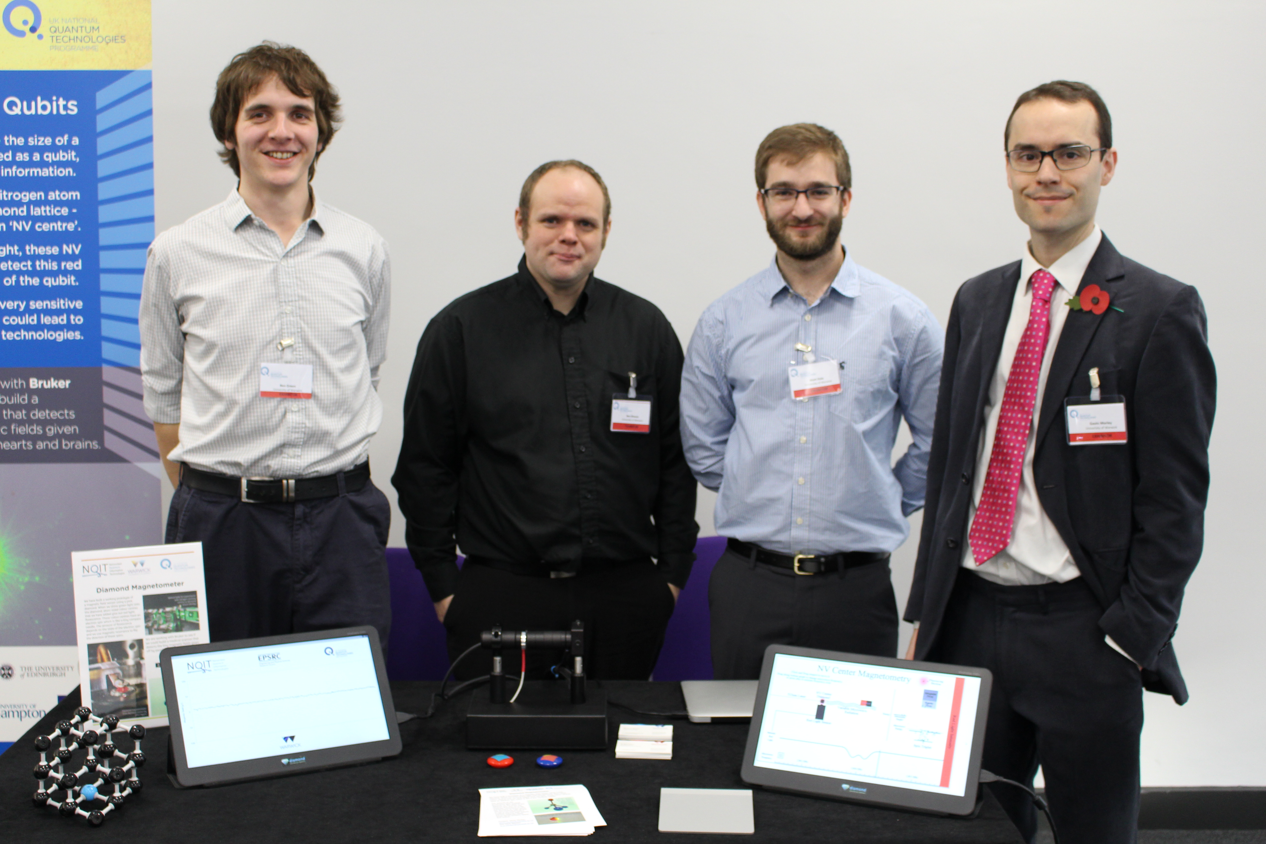 University of Warwick researchers demonstrating their diamond magnetometer at the Quantum Technology Showcase 2016 in Westminster. From left: Ben Green, Ben Breeze, Matt Dale and Gavin Morley. 